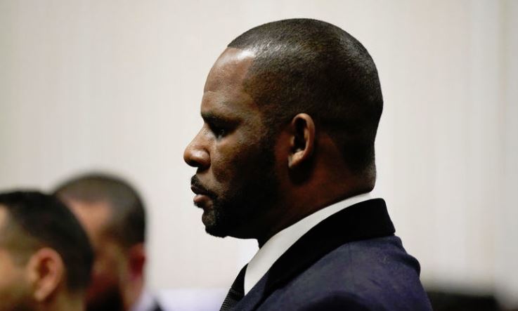 R. Kelly is arrested by feds on new charges while walking his dog in Chicago