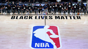 NBA players and coaches kneel during national anthem as season restarts